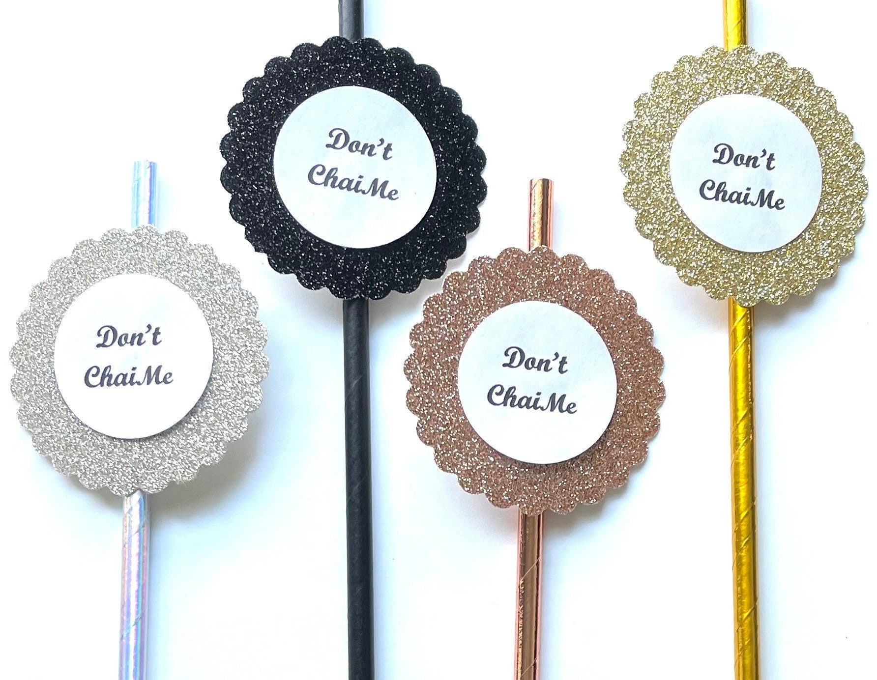 Four glittery circular paper straws with scalloped edges and the printed text 'Don't Chai Me' on a white background.