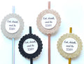 Four round cocktail picks with glittery circular toppers and the printed phrase 'Eat, drink, and be SCARY!' on a white background.