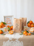 She found her main squeeze paper, Party Favor bags with orange and white stripes and a Clementine