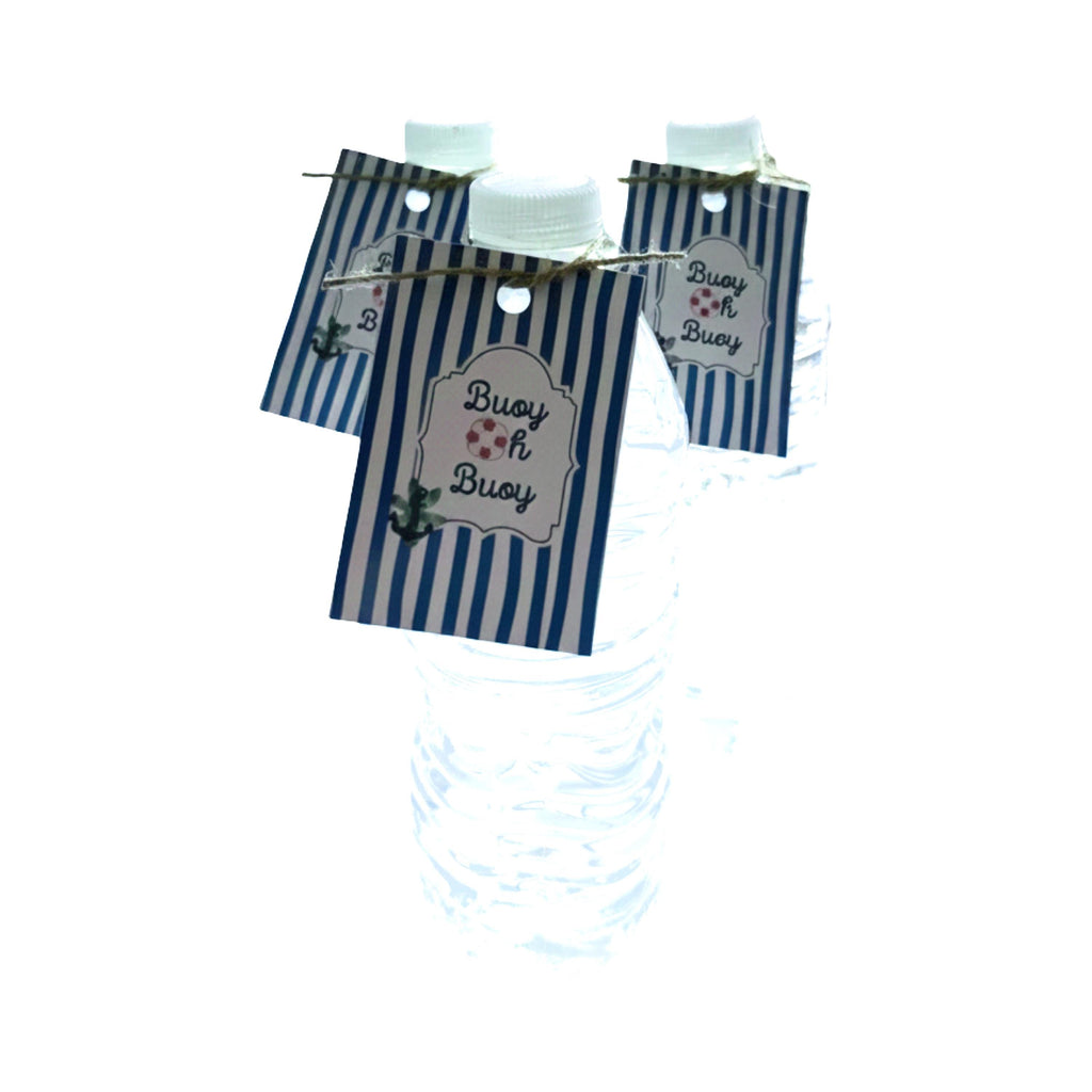 Three clear plastic water bottles with white caps, each decorated with a navy blue and white striped paper tag that reads 'Buoy oh Buoy' on a white background.