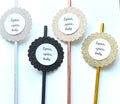 Four decorative straws with round glittery scalloped end pieces and white center labels reading 'Spice, spice, baby' on a white background.
